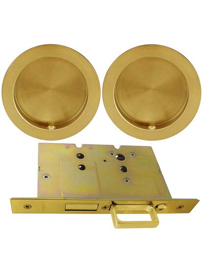 Premium Dummy Pocket-Door Mortise Lock Set with Round Pulls in Aged Brass.